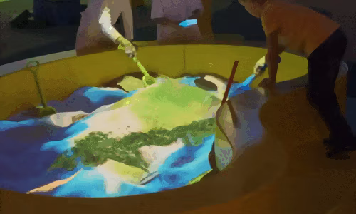 children-interacting-animated-sand-table